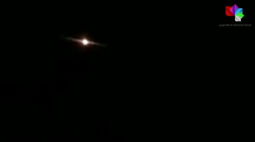 This image grab taken from a handout video released by Syrian state television shows lights in the sky reportedly over Aqraba, southeast of the capital Damascus, during an Israeli air strike