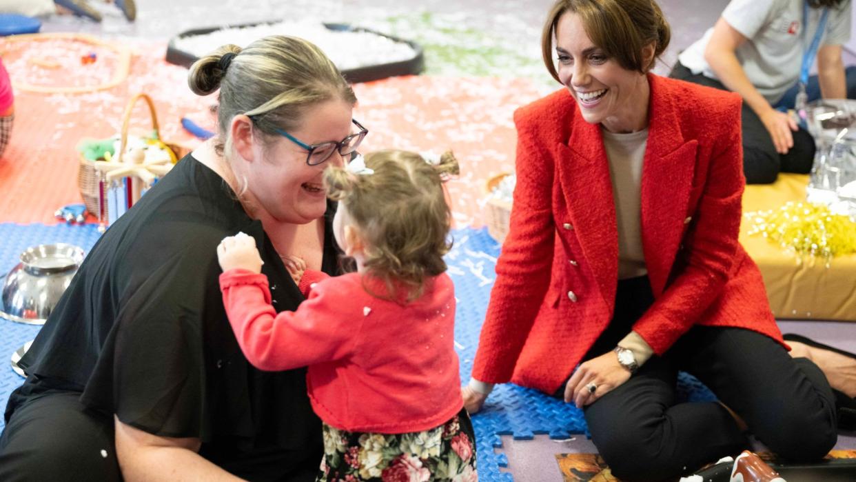 Princess Kate sitting with one-year-old Skylar during a portage session