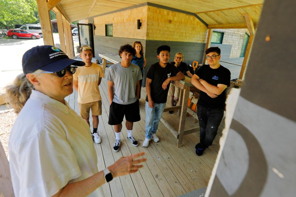 Kathryn Duff, Studio 2 Sustain architect, speaks with Greater New Bedford Vocational Technical High School students on the different materials used to buiild the Living Building Challenge building at the LLoyd Center for the Environment in Dartmouth.