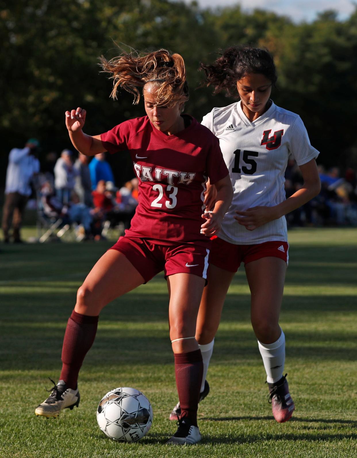 Faith Christian Eagles Abigail Sprunger (23) takes the ball from Lafayette Jeff Bronchos Janeli Diaz-Gaeta (15) during the IHSAA girls soccer game, Thursday, Sept. 22, 2022, at Faith Christian High School in Lafayette, Ind.