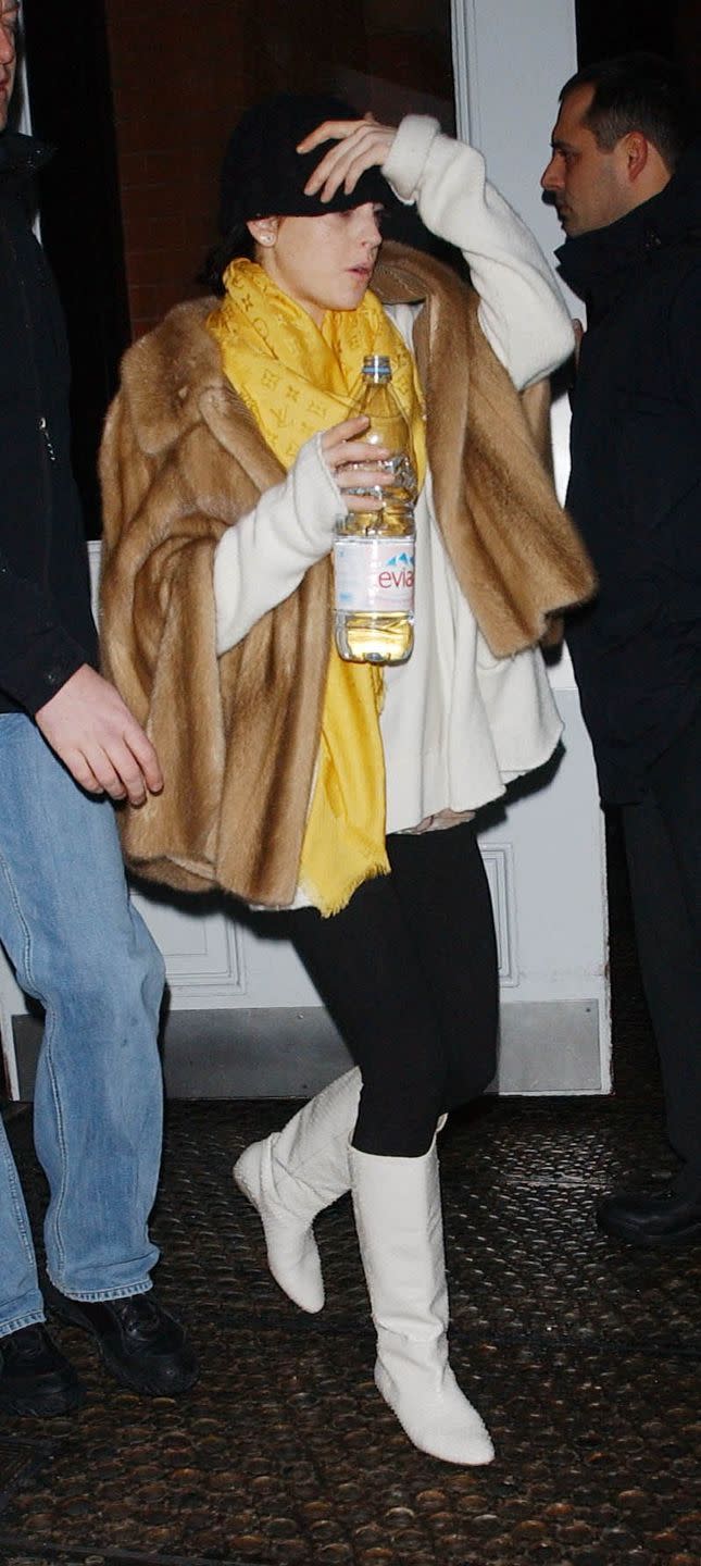 <p>Lindsay Lohan bundles up in a fur coat and scarf as she arrives at the airport in New York City. </p>