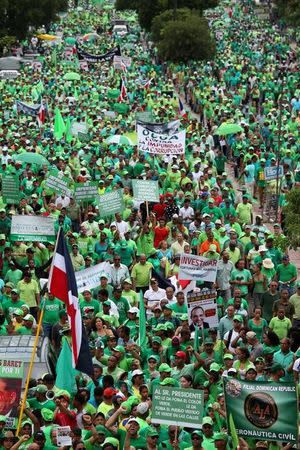 People march during a protest against corruption and the Brazilian conglomerate Odebrecht SA in Santo Domingo, Dominican Republic, July 16, 2017. REUTERS/Ricardo Rojas