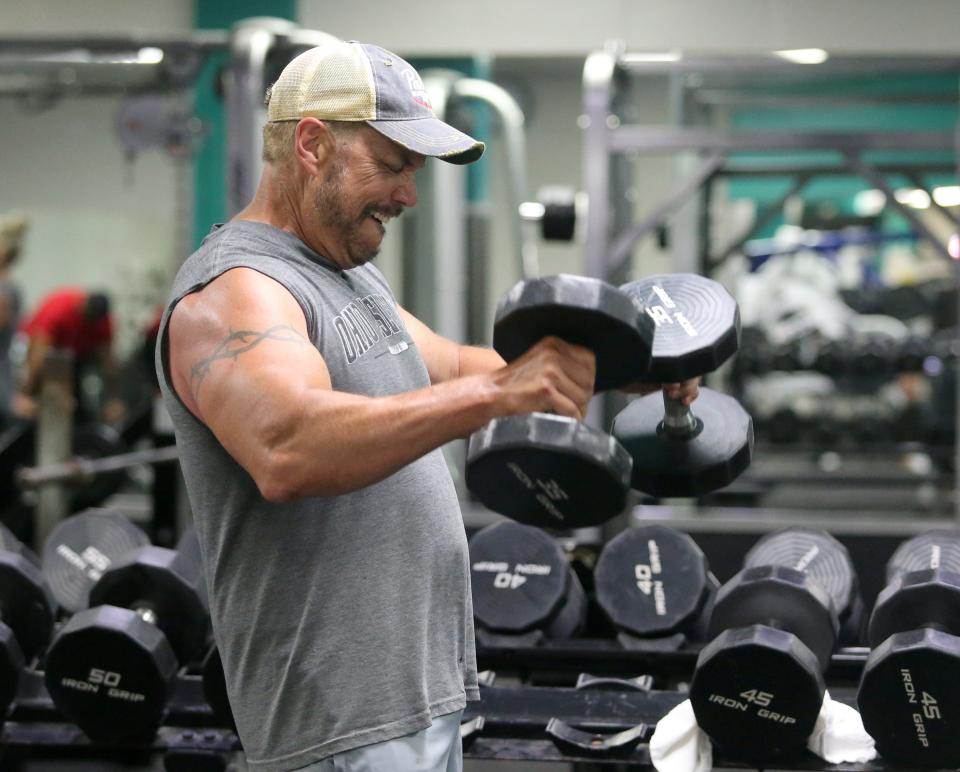 Ernie Adams works out at the YMCA in North Canton on Wednesday, June 29, 2022. The facility reopened today after being closed for six days due to a pool leak. Adams has been coming to the North Canton YMCA for 50 years.