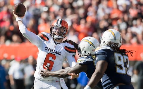 Cleveland Browns quarterback Baker Mayfield (6) throws under pressure from Los Angeles Chargers defensive end Melvin Ingram (54) during the first half at FirstEnergy Stadium - Credit: (Ken Blaze/USA Today)