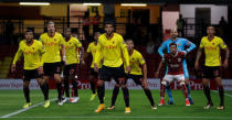 Soccer Football - Carabao Cup Second Round - Watford vs Bristol City - Watford, Britain - August 22, 2017 Watford's Etienne Capoue, Heurelho Gomes and teammates with Bristol City's Freddie Hinds in the penalty area Action Images via Reuters/Andrew Couldridge