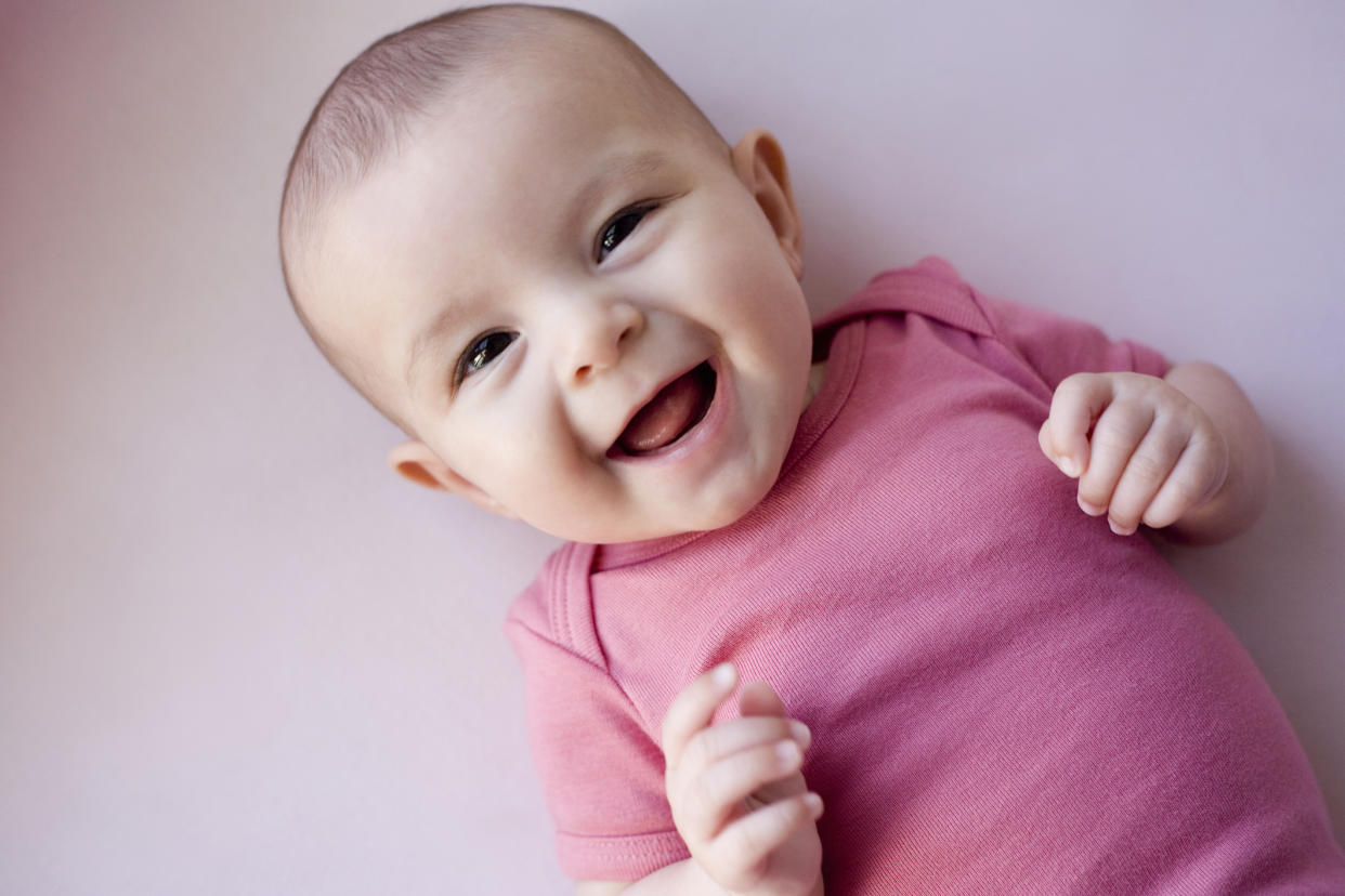  Baby girl laughing. 