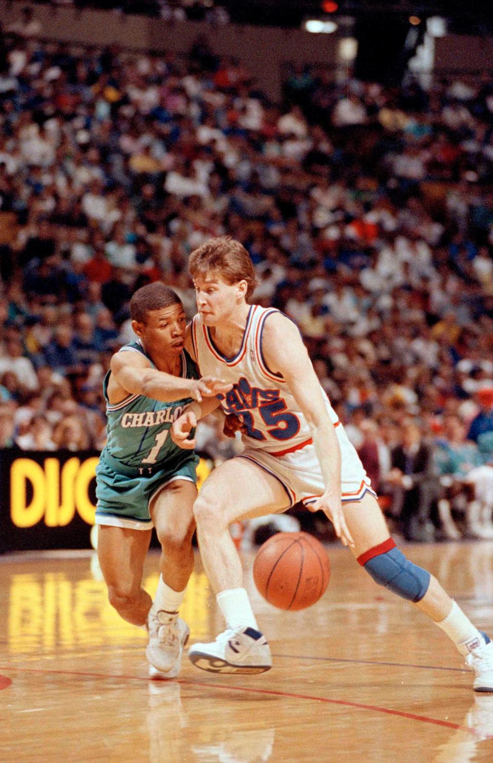 Cavaliers guard Mark Price drives against Tyrone "Muggsy" Bogues of the Charlotte Hornets, April 10, 1989. Price went a club-record 18-of-18 from the free throw line in scoring 35 in a win.