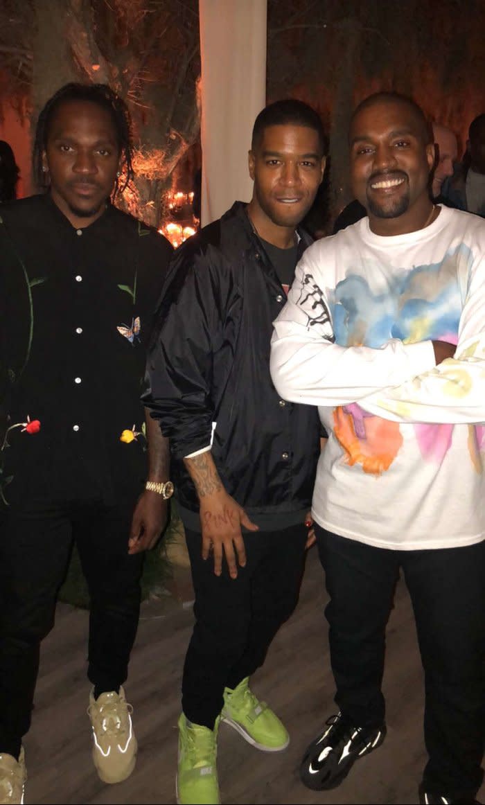 Smile for the camera: Kanye posed with pals Pusha T and Kid Cudi at the party. Source: kimkardashian/snapchat