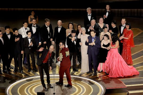 PHOTO: Daniel Scheinert and Daniel Kwan accept the Best Picture Oscar for 'Everything Everywhere All at Once' along with cast and crew onstage during the 95th Annual Academy Awards, March 12, 2023, in Hollywood, Calif. (Kevin Winter/Getty Images)