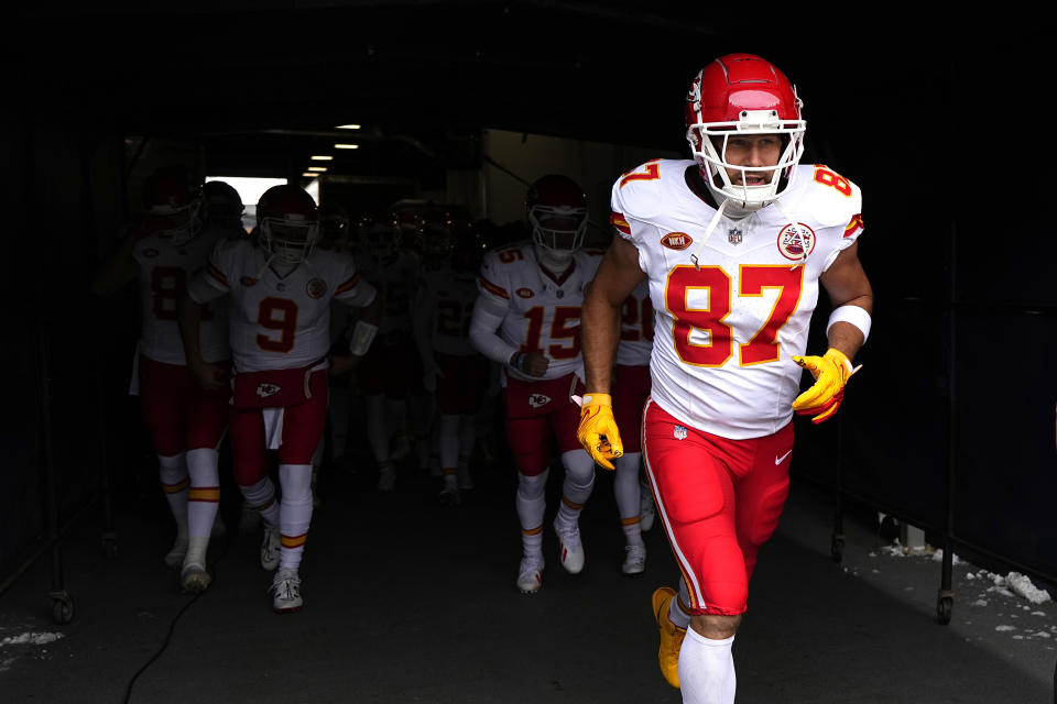 Kansas City Chiefs tight end Travis Kelce (87) jogs out to warm up before the start of an NFL football against the Denver Broncos Sunday, Oct. 29, 2023, in Denver. (AP Photo/Jack Dempsey)