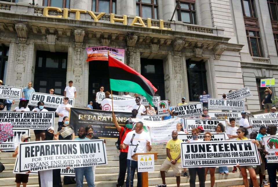 Ryan P. Haygood, president and CEO of the New Jersey Institute for Social Justice, speaks at the 2021 Junteenth rally for reparations in Newark.