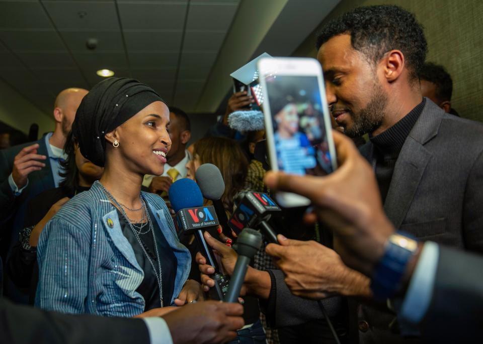 Ilhan Omar, left, newly elected to the U.S. House of Representatives on the Democratic ticket, speaks to the media in Minneapolis on Nov. 6, 2018.