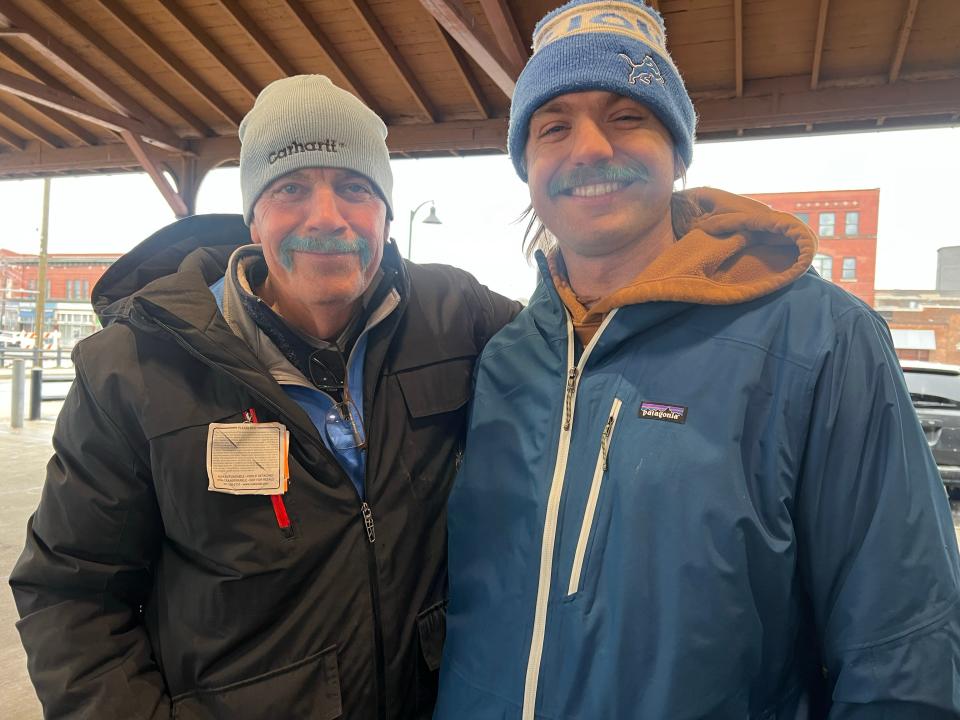 John Eisley, 68, and his son, Ryan Eisley, 26, both of Chelsea, dyed their mustaches blue to celebrate the NFC Championship game between the Lions and the 49ers. They both plan to attend the watch party at Ford Field on Sunday, Jan. 28, 2024.