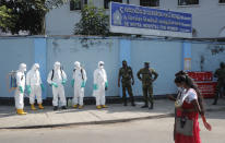 Sri Lankan police commandos prepare to spray disinfectants in a hospital in Colombo, Sri Lanka, Friday, March 27, 2020. The new coronavirus causes mild or moderate symptoms for most people, but for some, especially older adults and people with existing health problems, it can cause more severe illness or death. (AP Photo/Eranga Jayawardena)
