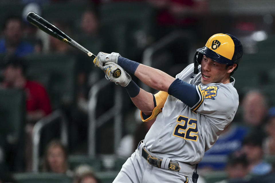 Milwaukee Brewers' Christian Yelich drives in two runs with a base hit in the sixth inning of a baseball game against the Atlanta Braves, Friday, May 6, 2022, in Atlanta. (AP Photo/John Bazemore)
