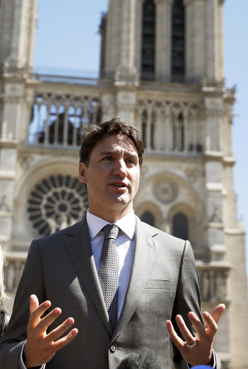 Canadian Prime Minister Justin Trudeau adresses reporters after visiting Notre Dame cathedral in Paris, Wednesday, May 15, 2019. Trudeau is in Paris for a meeting with World leaders and tech bosses to make a joint push to eliminate acts of violent extremism from being shown online. (AP Photo/Christophe Ena)