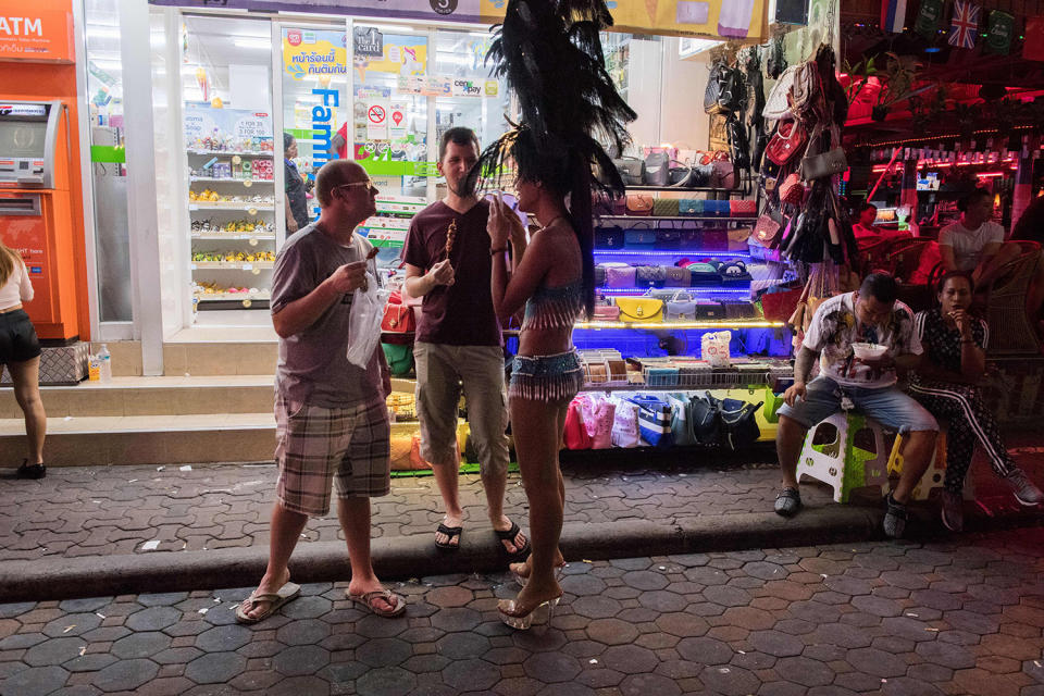 Tourists talking to woman on street