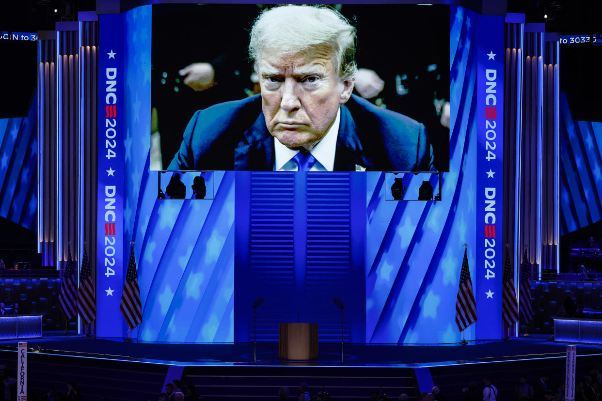 CHICAGO, ILLINOIS - AUGUST 19: A video featuring a courtroom photo of Republican presidential candidate former President Donald Trump plays during the first day of the Democratic National Convention at the United Center on August 19, 2024 in Chicago, Illinois.  Delegates, politicians, and Democratic party supporters are in Chicago for the convention, concluding with current Vice President Kamala Harris accepting her party's presidential nomination. The DNC takes place from August 19-22. (Photo by Chip Somodevilla/Getty Images)