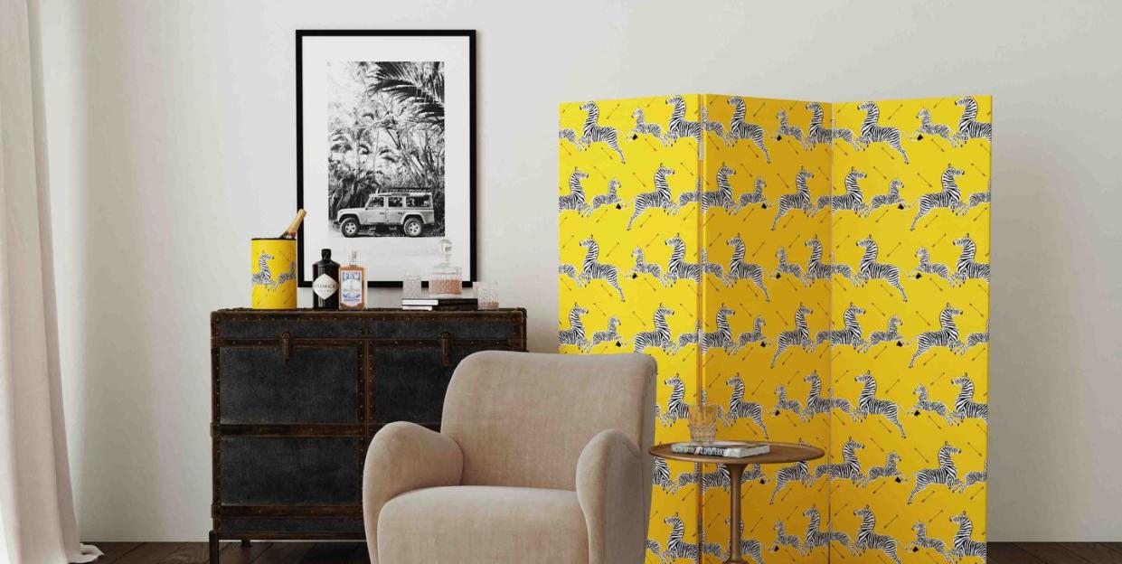 yellow zebra covered divider in bedroom