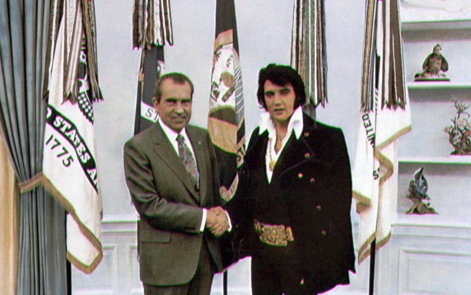 In this file photo from Dec. 21, 1970, President Richard Nixon, left, and Elvis Presley meet at the White House.