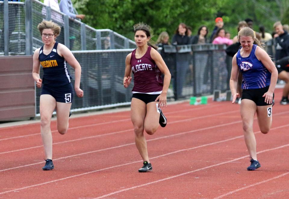 Johnson City's Patricia Nester, center, runs to first place in the girls 100-meter dash at the Southern Tier Athletic Conference track & field championships May 18, 2022 at Johnson City High School.