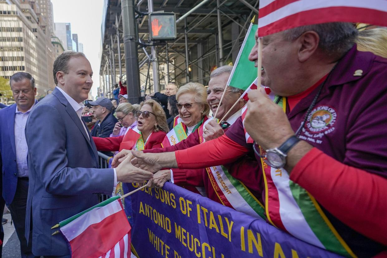 Republican candidate for New York Governor Congressman Lee Zeldin, front left, greets spectators as he marches up 5th Avenue during the annual Columbus Day Parade, Monday, Oct. 10, 2022, in New York. 