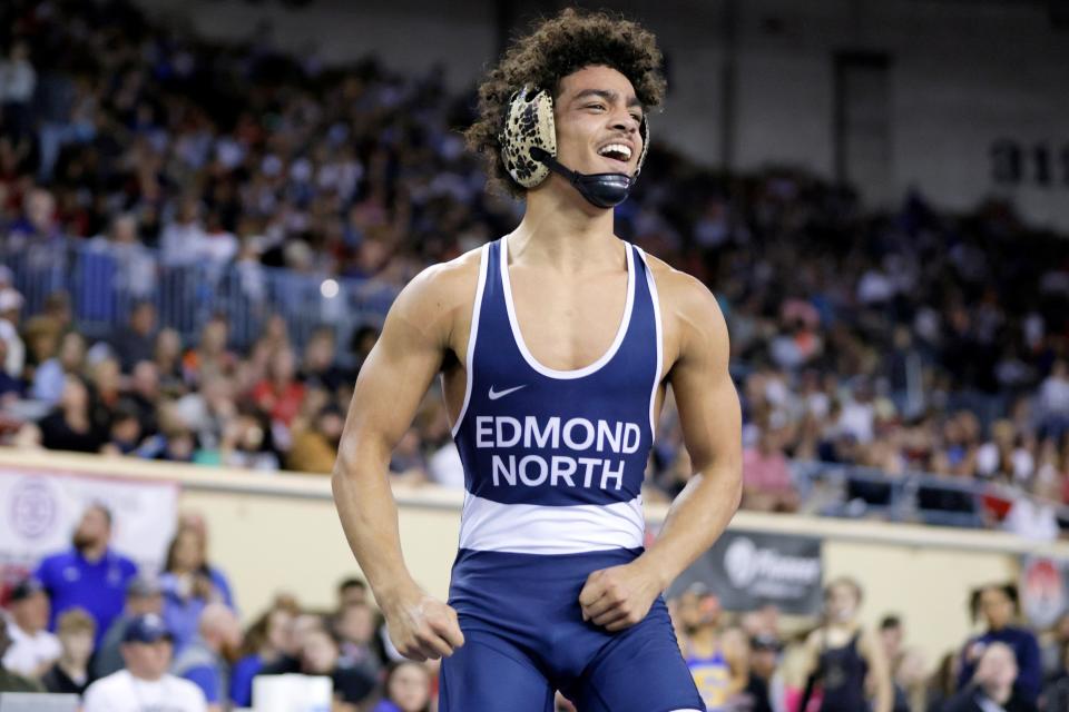 Edmond North's Devon Miller celebrates after winning the Class 6A 120-pound match during the high school state wrestling tournament championships at State Fair Arena in Oklahoma City, Saturday, Feb. 24, 2024.