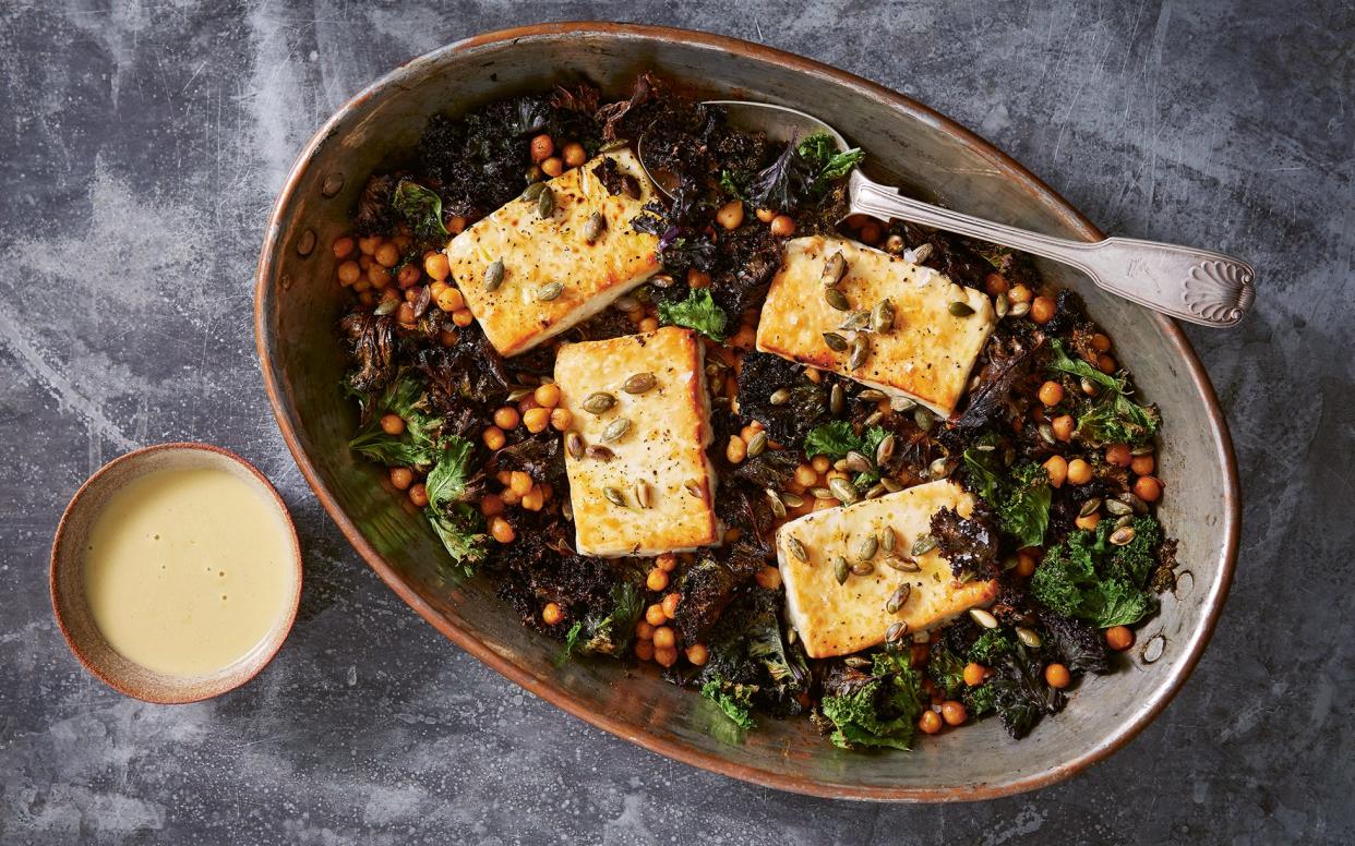 Tangy baked feta on a bed of greens and roasted chickpeas  - Â© Patricia Niven