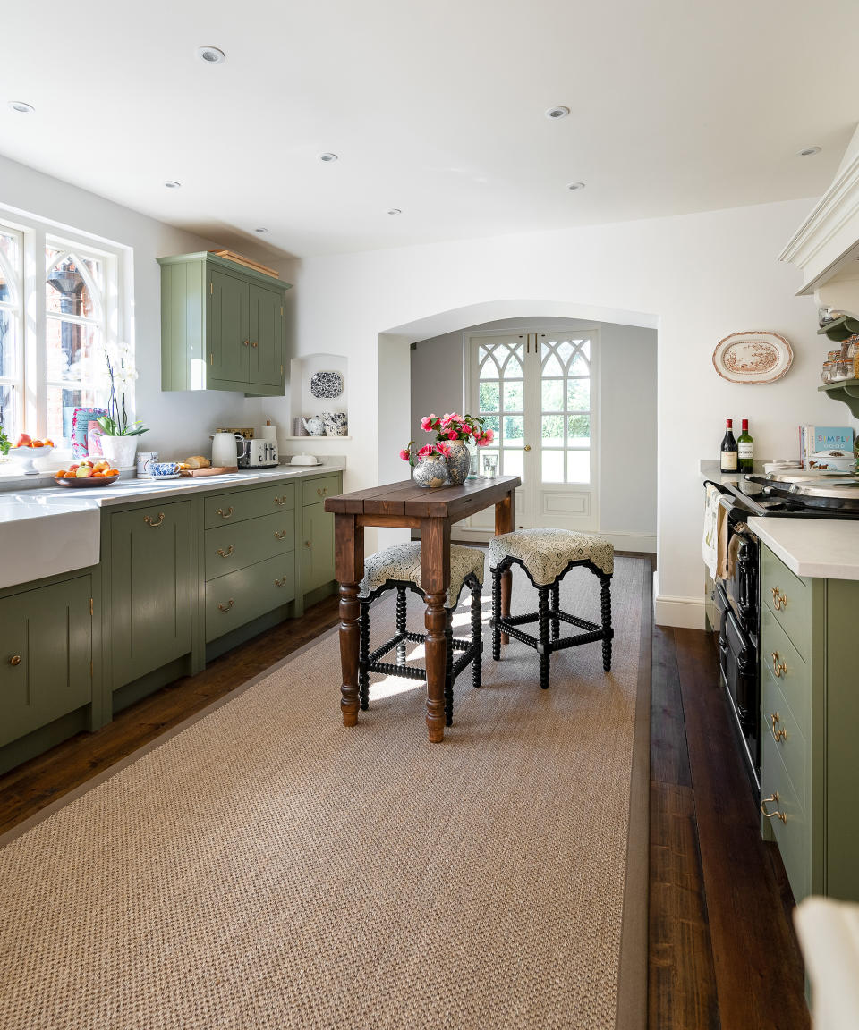 <p> This British Standard by Plain English kitchen, designed for fashion and lifestyle journalist Louise Roe, is finished in Little Green Paint Company’s Sage Green and topped with 5000 London Grey quartz surfaces from Caesarstone.  </p> <p> The galley design didn’t offer much room for dining, so Louise commissioned a local craftsman to create a bespoke island from timber left over from the hardwood flooring.  </p>