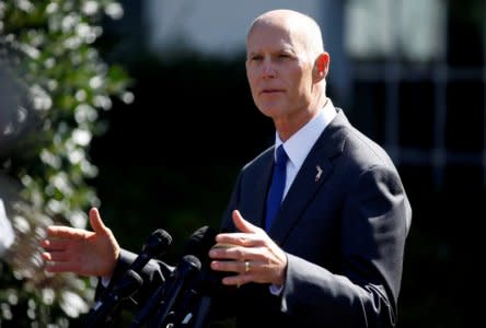 FILE PHOTO:    Florida Governor Rick Scott speaks about hurricane relief measures for Florida and Puerto Rico at the White House in Washington, U.S., September 29, 2017.   REUTERS/Joshua Roberts/File Photo