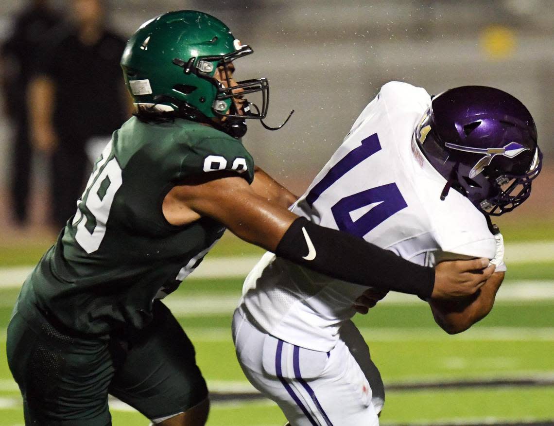 Kennedale’s Paosa Utu grabs Alvaredo’s Jaylon Bridgewater for a loss in the fourth quarter of Friday’s September 2, 2022 football game at Wildcat Stadium in Kennedale, Texas. Kennedale went on to win 27-12. Special/Bob Haynes Bob Haynes/Special to the Star-Telegram