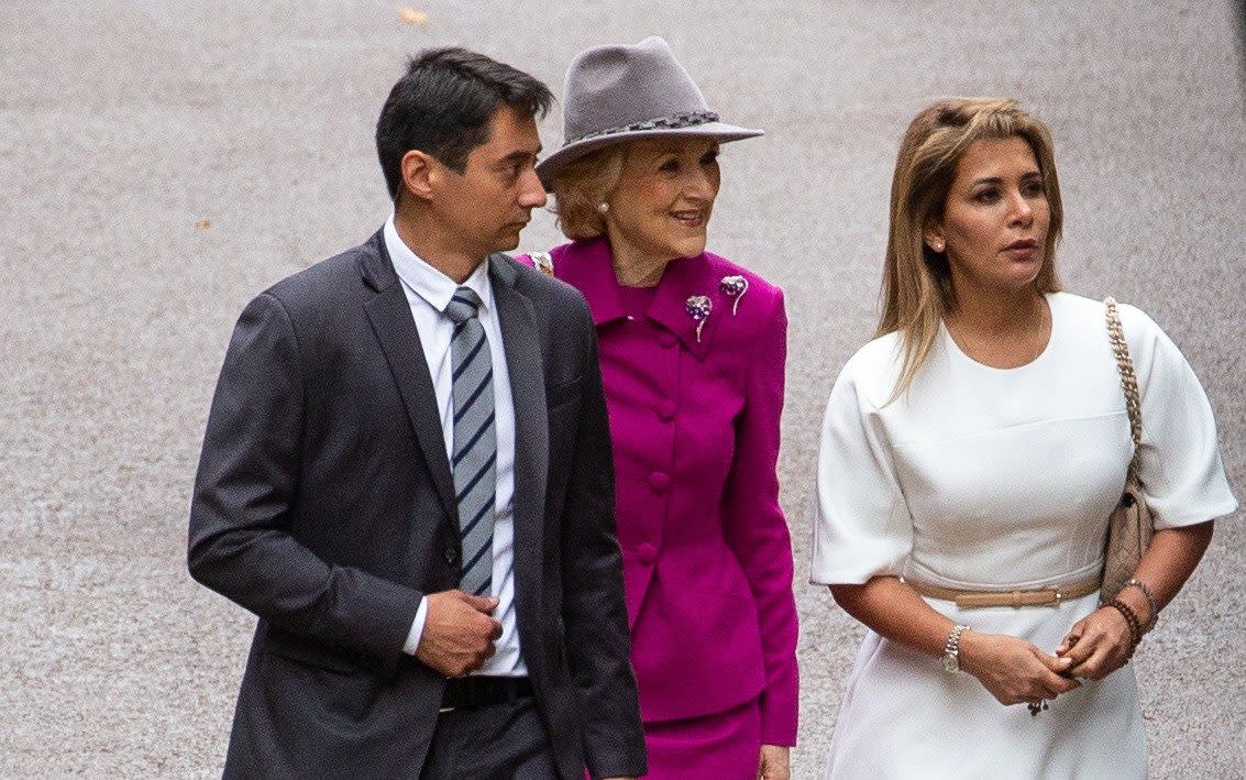 Princess Haya (right in white) seen for first time since fleeing Dubai as she arrives for High Court hearing - i-Images Picture Agency