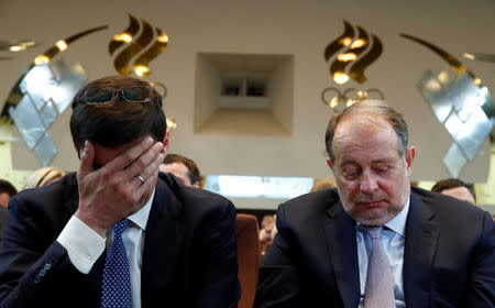 Former Russian Olympic swimming champion and candidate for the Russian Olympic Committee presidency, Alexander Popov and Vladimir Lisin, chairman of the board of directors of Russian steelmaker NLMK, attend a meeting to vote for a new head of the committee at its headquarters in Moscow, Russia May 29, 2018. REUTERS/Maxim Shemetov