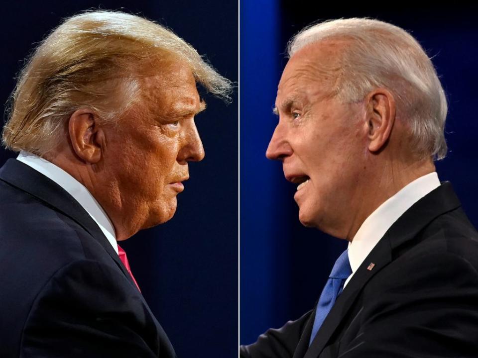 Donald Trump and Joe Biden during the final presidential debate at Belmont University in Nashville, Tennessee, on October 22, 2020. (Photo by MORRY GASH,JIM WATSON/AFP via Getty Images)