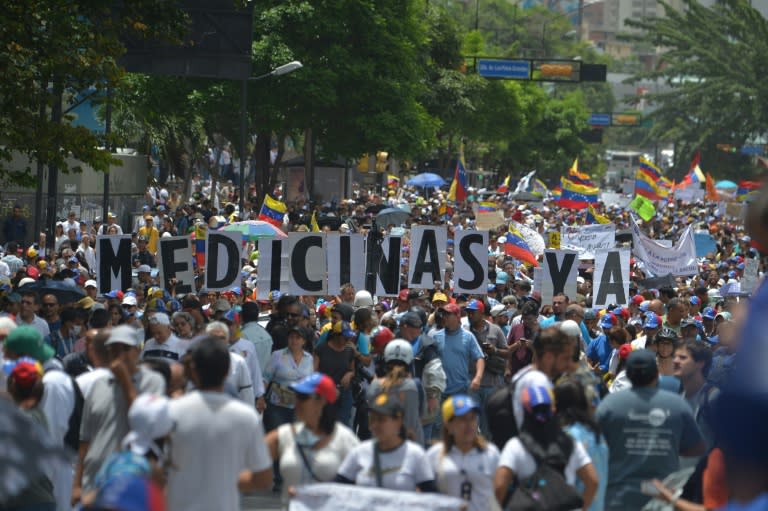 Doctors and other health care personnel march in Caracas on May 22, 2017