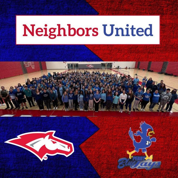 Dallas Center-Grimes School District students and staff dress in blue to show solidarity with Perry High School after its shooting tragedy.