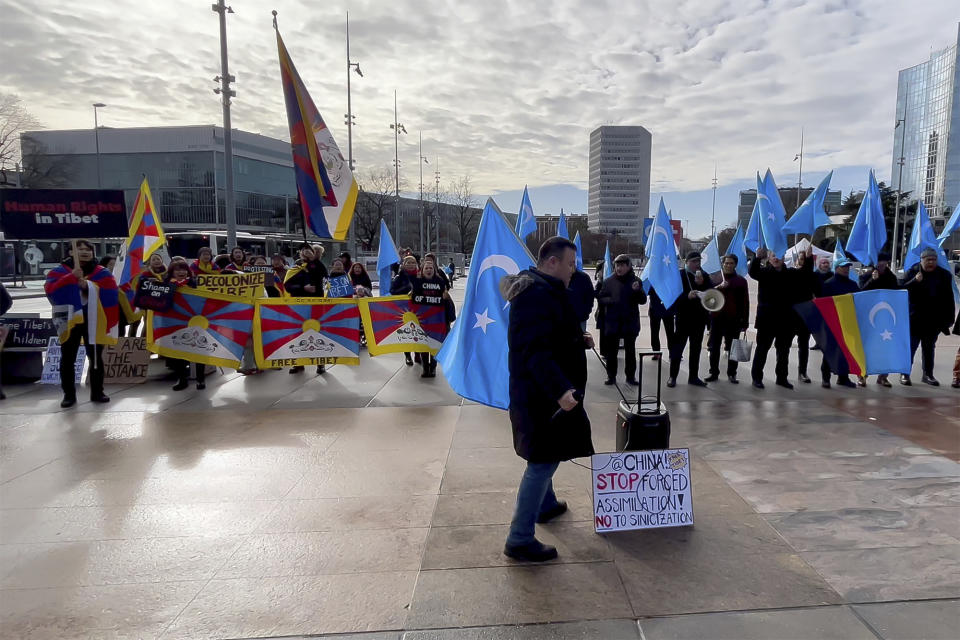 Activists supporting Tibet and the Uyghur minority in China protest against what they consider unfair Chinese government policies outside the U.N. office in Geneva, Switzerland, Tuesday, Jan. 23, 2024. The demonstration outside the U.N. office in Geneva came as China's government faced a regular review of its human rights record at a Human Rights Council meeting inside. (AP Photo/Jamey Keaten)