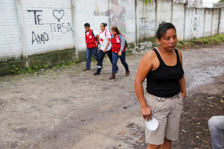 Relative of victims of the eruption of the Fuego volcano waits outside the morgue of Escuintla, Guatemala June 7, 2018. REUTERS/Luis Echeverria