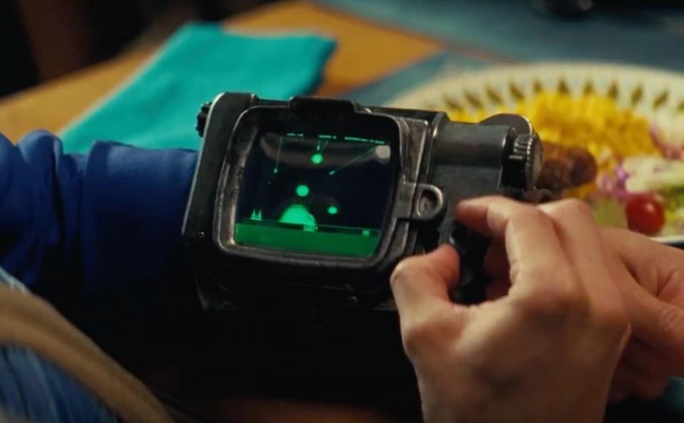 Norm playing Atomic Command on his Pip-Boy in "Fallout."