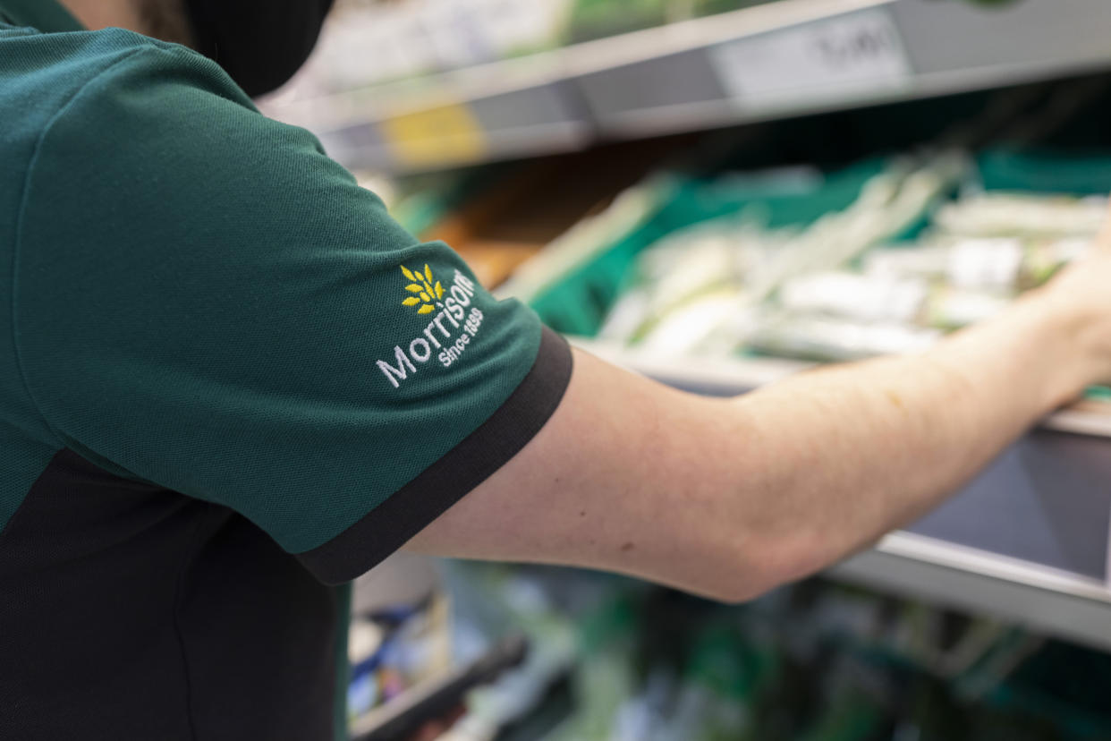 A uniformed member of staff sorts through fresh produce in British supermarket chain Morrisons on 23rd August, 2021 in Leeds, United Kingdom. British supermarket chain Morrisons, which employs over 110,000 staff across its 500 shops, has accepted a £6.3bn ($8.7bn) takeover bid from US private equity firm Fortress Investment Group. (photo by Daniel Harvey Gonzalez/In Pictures via Getty Images)