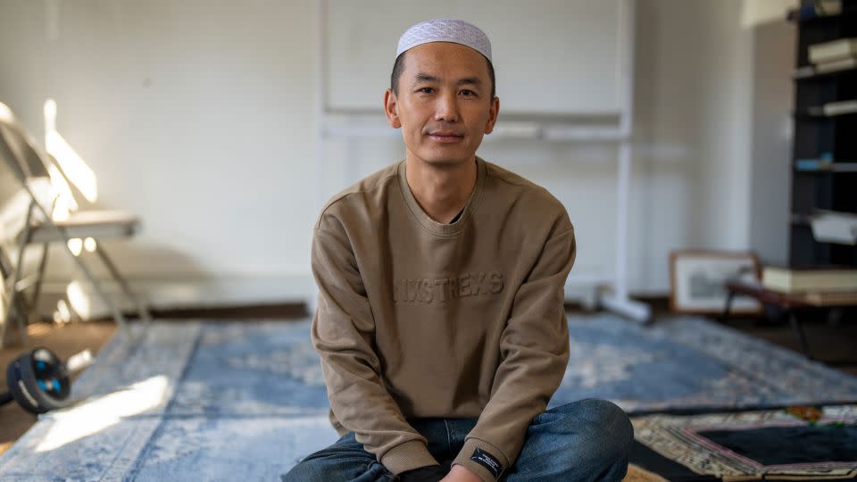 Ye Chengxiang smiles from Flushing house, which was set up for Muslim migrants from China. - Evelio Contreras/CNN