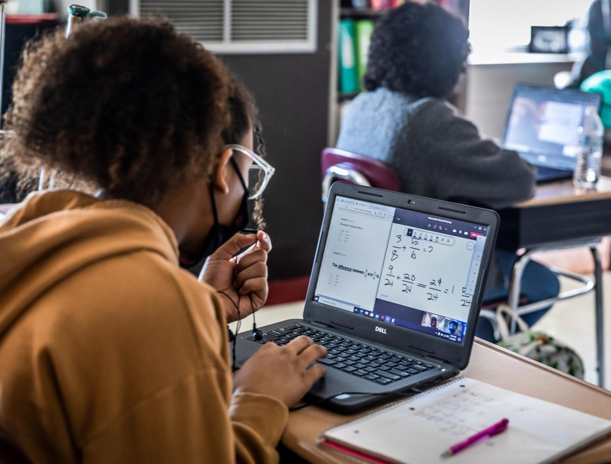 Delaney Edwards works with a tutor virtually in her classroom at DuPont Hadley Middle School Wednesday, March 10, 2021.  