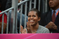 The First Lady Michelle Obama takes in the game between the USA Mens Senior National team against France at the Olympic Park Basketball Arena during the London Olympic Games on July 29, 2012 in London, England. NOTE TO USER: User expressly acknowledges and agrees that, by downloading and/or using this Photograph, user is consenting to the terms and conditions of the Getty Images License Agreement. Mandatory Copyright Notice: Copyright 2012 NBAE (Photo by Jesse D. Garrabrant/NBAE via Getty Images)