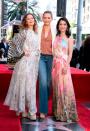 Actress Drew Barrymore, Cameron Diaz and Lucy Liu showed off their diverse styles during Liu's Walk of Fame ceremony in Hollywood on May 1, 2019. Liu wore a flower print one-shoulder dress by Peter Pilotto, while Barrymore worked a floaty dress and heels.<em> [Photo: VALERIE MACON/AFP/Getty Images]</em>