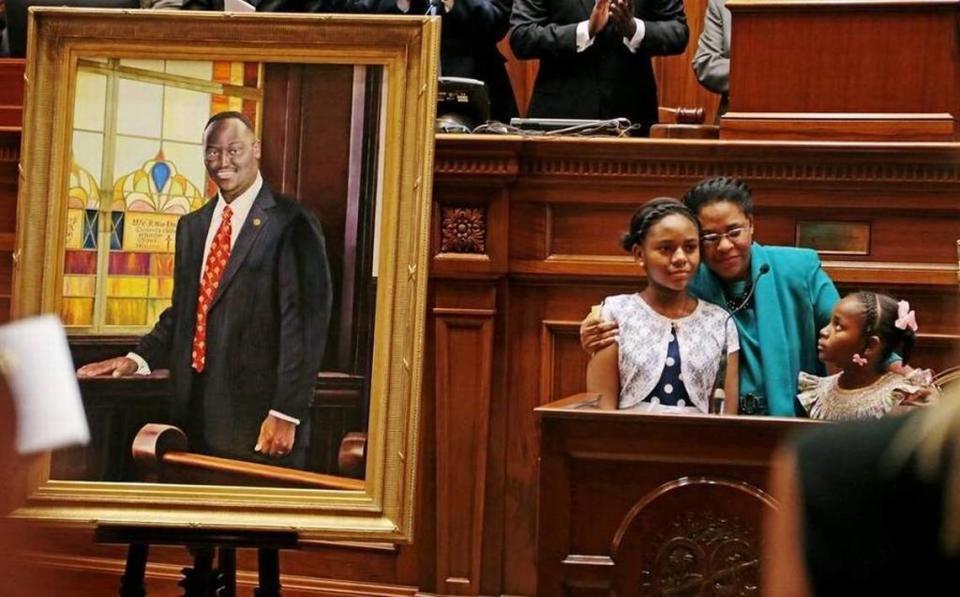 Clementa Pinckney’s widow Jennifer and daughters, Eliana and Malana, embrace after unveiling his portrait in the SC Senate Chamber on May 25, 2016. The Reverend Pinckney Scholars Program created in Pinckney’s memory is open to applications through March 17.