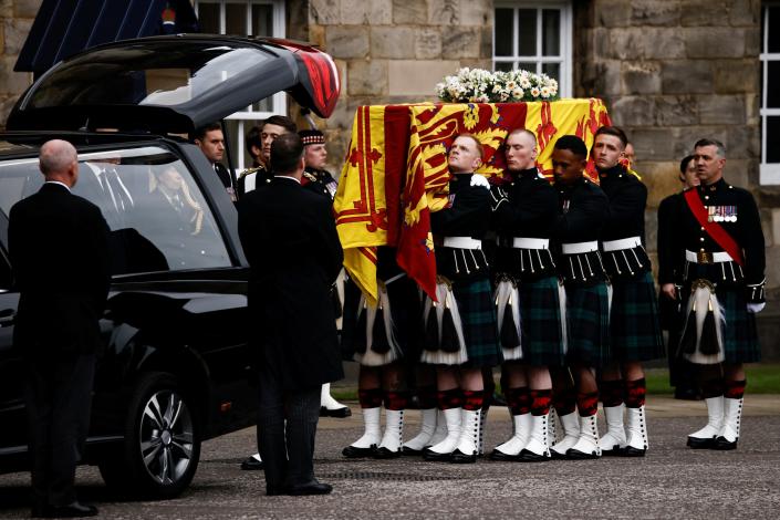 September 11: Pallbearers carry the coffin of Britain's Queen Elizabeth II as the hearse arrives at the Palace of Holyroodhouse in Edinburgh.