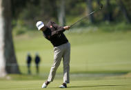 Adam Scott, of Australia, hits his second shot on the 17th hole during the second round of the Genesis Invitational golf tournament at Riviera Country Club, Friday, Feb. 14, 2020, in the Pacific Palisades area of Los Angeles. (AP Photo/Ryan Kang)