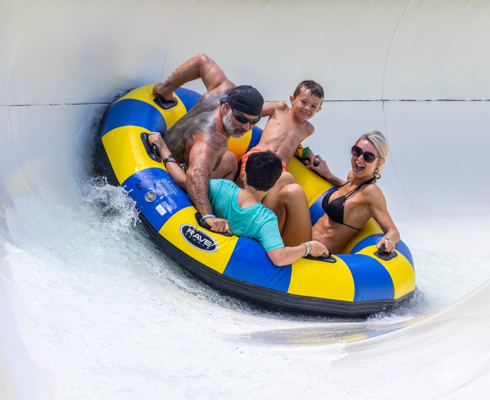 Michael Harvey, his wife, Barbi, and sons Cruz and Bryson, from Indianapolis, come down White Knuckle River and brace themselves for a landing at Shipwreck Island Waterpark on Wednesday.
