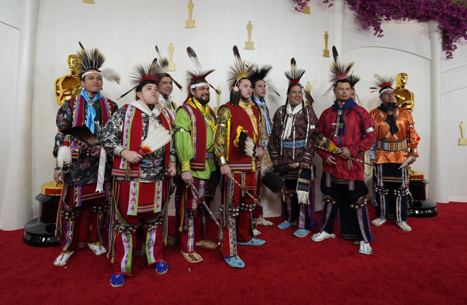 Osage singers and dancers arrive at the Oscars on Sunday, March 10, 2024, at the Dolby Theatre in Los Angeles. (AP Photo/Ashley Landis)