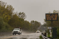 A sign informs drivers of a closure along Highway 1 in Carmel, Calif., Monday, Dec. 13, 2021. A major storm hitting Northern California is expected to intensify and bring travel headaches and a threat of localized flooding after an abnormally warm fall in the U.S. West. (AP Photo/Nic Coury)